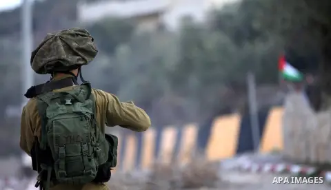 Palestinian protestors, from the nearby Palestinian village of Naqura, confront Israeli security forces close to the Jewish settlement of Shavei Shomron near the West Bank city of Tulkarem on December 14, 2017, as protes...