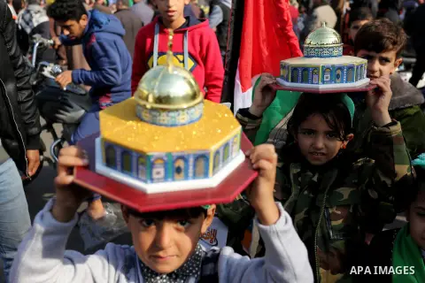 Palestinians take part during a protest against US President Donald Trump's decision to recognise Jerusalem as the capital of Israel, in al-Bureij in the central of Gaza strip, on December 15, 2017. Thousands of Palestin...