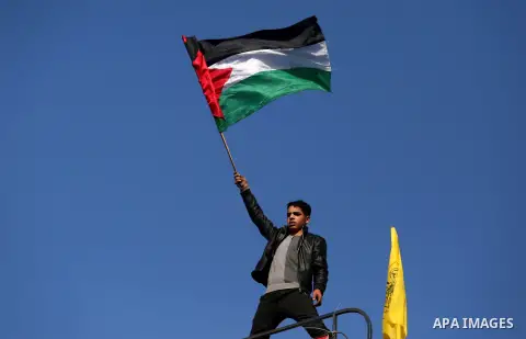 Palestinians take part during a protest against US President Donald Trump's decision to recognise Jerusalem as the capital of Israel, in al-Bureij in the central of Gaza strip, on December 15, 2017. Thousands of Palestin...