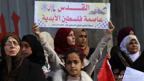 Palestinians take part in a protest against US President Donald Trump's decision to recognise Jerusalem as the capital of Israel, in Khan youis in the southen of Gaza strip, on December 15, 2017. Thousands of Palestinian...