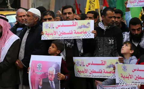 Palestinians take part in a protest against US President Donald Trump's decision to recognise Jerusalem as the capital of Israel, in Khan youis in the southen of Gaza strip, on December 15, 2017. Thousands of Palestinian...