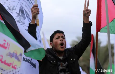 Palestinians take part in a protest against US President Donald Trump's decision to recognise Jerusalem as the capital of Israel, in Khan youis in the southen of Gaza strip, on December 15, 2017. Thousands of Palestinian...