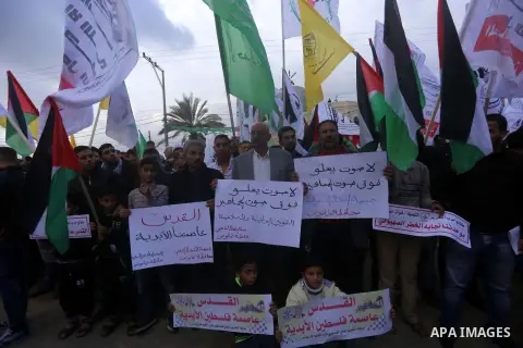 Palestinians take part in a protest against US President Donald Trump's decision to recognise Jerusalem as the capital of Israel, in Khan youis in the southen of Gaza strip, on December 15, 2017. Thousands of Palestinian...