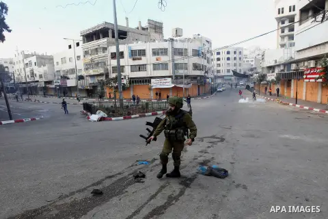 Israeli security forces take position during clashes with Palestinian protesters in the city centre of the occupied West Bank town of Hebron on December 15, 2017 as demonstrations continue to flare in the Middle East and...