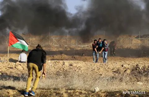 Palestinian protesters clash with Israeli forces, in Khan Younis in the southern Gaza Strip, on December 15, 2017. Thousands of Palestinians protested again in Jerusalem against US President Donald Trump's decision to re...