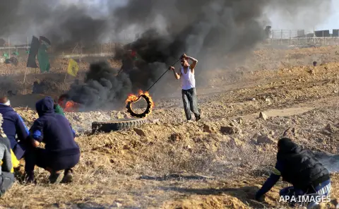 Palestinian protesters clash with Israeli forces, in Khan Younis in the southern Gaza Strip, on December 15, 2017. Thousands of Palestinians protested again in Jerusalem against US President Donald Trump's decision to re...