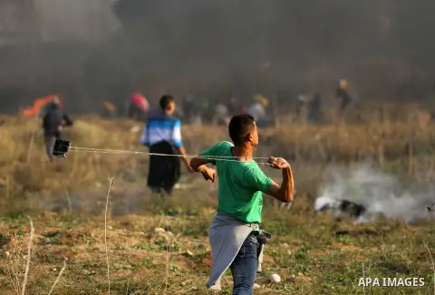 Palestinian protesters clash with Israeli security forces near the border fence with Israel, east of Gaza City on December 15, 2017 as demonstrations continue over US President Donald Trump's declaration of Jerusalem as...