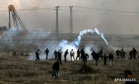 Palestinian protesters clash with Israeli security forces near the border fence with Israel, east of Gaza City on December 15, 2017 as demonstrations continue over US President Donald Trump's declaration of Jerusalem as...