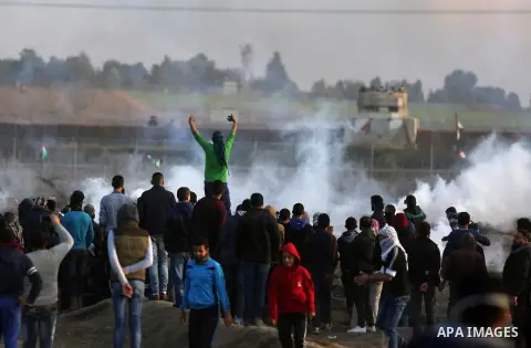Palestinian protesters clash with Israeli security forces near the border fence with Israel, east of Gaza City on December 15, 2017 as demonstrations continue over US President Donald Trump's declaration of Jerusalem as...