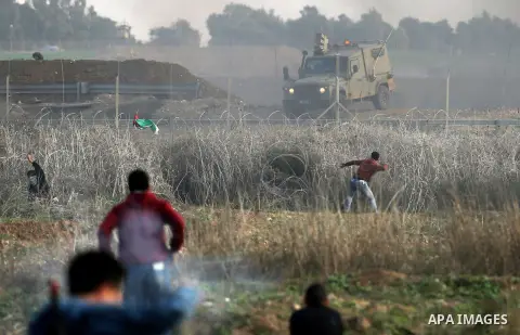 Palestinian protesters clash with Israeli security forces near the border fence with Israel, east of Gaza City on December 15, 2017 as demonstrations continue over US President Donald Trump's declaration of Jerusalem as...