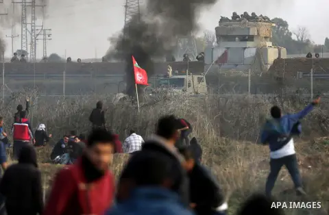 Palestinian protesters clash with Israeli security forces near the border fence with Israel, east of Gaza City on December 15, 2017 as demonstrations continue over US President Donald Trump's declaration of Jerusalem as...