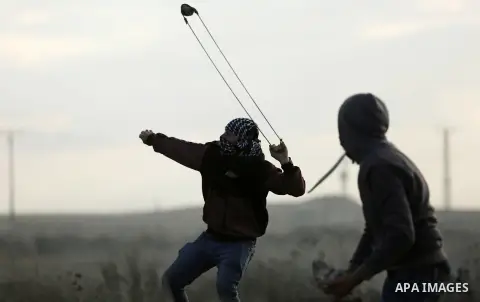 Palestinian protesters clash with Israeli security forces near the border fence with Israel, east of Gaza City on December 15, 2017 as demonstrations continue over US President Donald Trump's declaration of Jerusalem as...