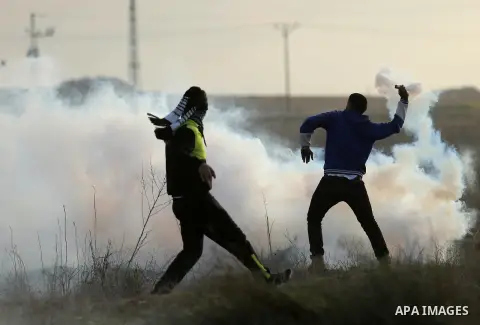 Palestinian protesters clash with Israeli security forces near the border fence with Israel, east of Gaza City on December 15, 2017 as demonstrations continue over US President Donald Trump's declaration of Jerusalem as...