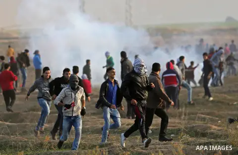 Palestinian protesters clash with Israeli security forces near the border fence with Israel, east of Gaza City on December 15, 2017 as demonstrations continue over US President Donald Trump's declaration of Jerusalem as...