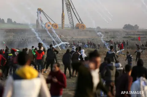 Palestinian protesters clash with Israeli security forces near the border fence with Israel, east of Gaza City on December 15, 2017 as demonstrations continue over US President Donald Trump's declaration of Jerusalem as...