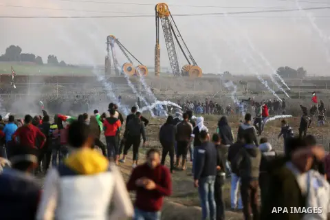 Palestinian protesters clash with Israeli security forces near the border fence with Israel, east of Gaza City on December 15, 2017 as demonstrations continue over US President Donald Trump's declaration of Jerusalem as...