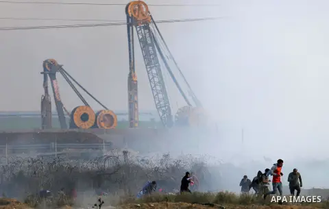 Palestinian protesters clash with Israeli security forces near the border fence with Israel, east of Gaza City on December 15, 2017 as demonstrations continue over US President Donald Trump's declaration of Jerusalem as...