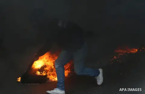 Israeli border clash with Palestinian protesters near the Huwara checkpoint, south of Nablus in the Israeli-occupied West Bank, on December 15, 2017, as protests continue in the region amid anger over US President Donald...