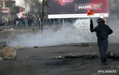 Israeli border clash with Palestinian protesters near the Huwara checkpoint, south of Nablus in the Israeli-occupied West Bank, on December 15, 2017, as protests continue in the region amid anger over US President Donald...