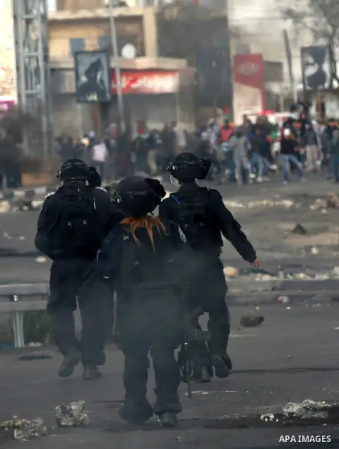 Israeli border clash with Palestinian protesters near the Huwara checkpoint, south of Nablus in the Israeli-occupied West Bank, on December 15, 2017, as protests continue in the region amid anger over US President Donald...