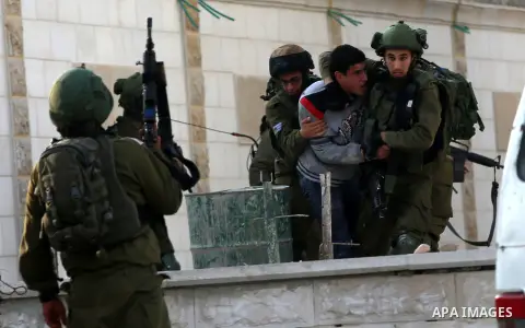 Israeli security forces arrest aPalestinian protester during clashes near the Huwara checkpoint, south of Nablus in the Israeli-occupied West Bank, on December 15, 2017, as protests continue in the region amid anger over...