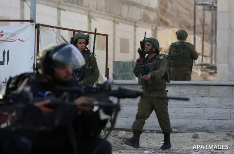 Israeli border clash with Palestinian protesters near the Huwara checkpoint, south of Nablus in the Israeli-occupied West Bank, on December 15, 2017, as protests continue in the region amid anger over US President Donald...