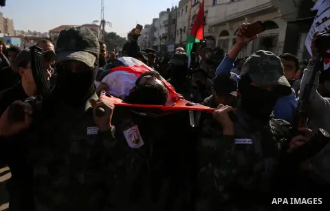 Palestinians carry the body of 29-year-old Ibrahim Abu Thurayeh during his funeral in Gaza City on December 16, 2017 after he was shot dead in clashes between Israeli forces and protesters along the Gaza-Israel border, a...