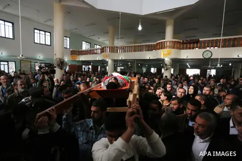 Palestinians carry the body of 29-year-old Ibrahim Abu Thurayeh during his funeral in Gaza City on December 16, 2017 after he was shot dead in clashes between Israeli forces and protesters along the Gaza-Israel border, a...