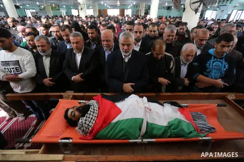 Hamas Chief Ismail Haniyeh prays over the body of 29-year-old Ibrahim Abu Thurayeh at the mosque during his funeral in Gaza City on December 16, 2017 after he was shot dead in clashes between Israeli forces and protester...