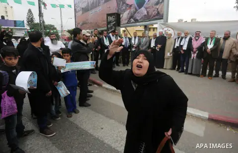 Palestinian supporters of Hamas movement take part in a protest against Trump's decision to recognize Jerusalem as the capital of Israel, in Gaza city, on December 18, 2017. Photo by Mohammed Asad