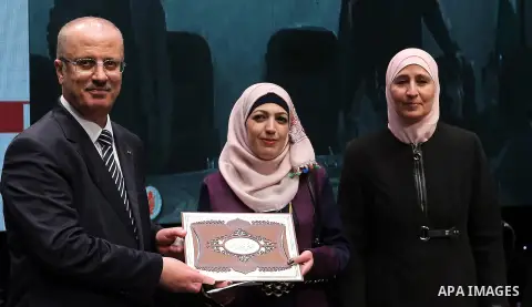 Palestinian Prime Minister, Rami Hamdallah, attends the celebration of Palestinian teacher day, in the West Bank city of Ramallah, on December 18, 2017. Photo by Prime Minister Office