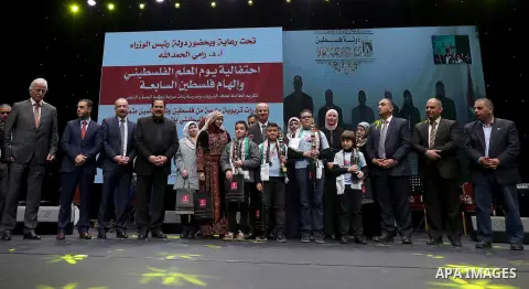 Palestinian Prime Minister, Rami Hamdallah, attends the celebration of Palestinian teacher day, in the West Bank city of Ramallah, on December 18, 2017. Photo by Prime Minister Office
