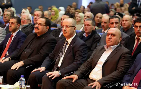 Palestinian Prime Minister, Rami Hamdallah, attends the celebration of Palestinian teacher day, in the West Bank city of Ramallah, on December 18, 2017. Photo by Prime Minister Office