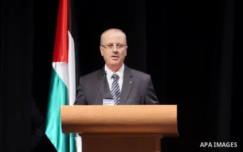 Palestinian Prime Minister, Rami Hamdallah, attends the celebration of Palestinian teacher day, in the West Bank city of Ramallah, on December 18, 2017. Photo by Prime Minister Office