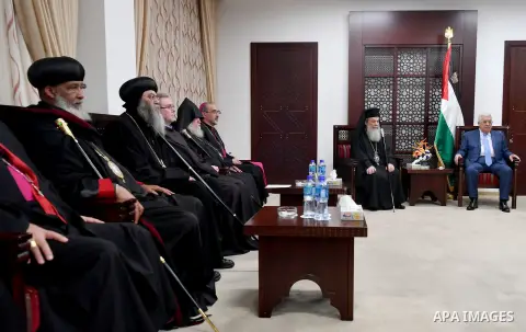 Palestinian President Mahmoud Abbas meets with a delegation of Churches at his headquarters in the West Bank city of Ramallah on December 18, 2017. Photo by Osama Falah