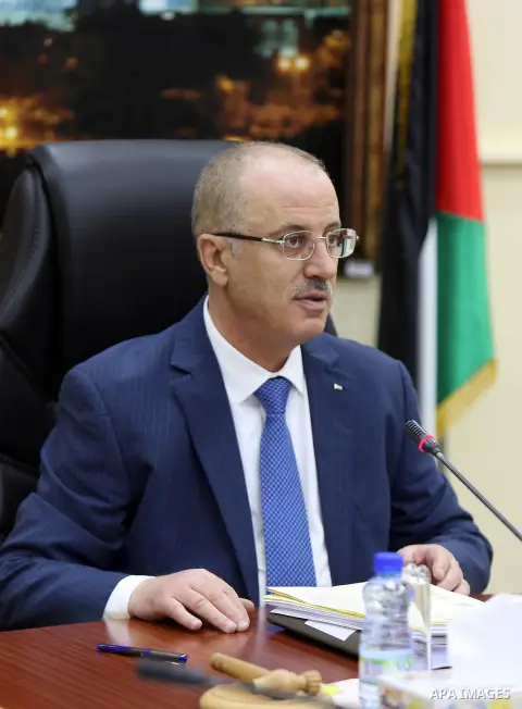 Palestinian Prime Minister Rami Hamdallah chairs a meeting of council of Ministers in the West Bank city of Ramallah on December 19, 2017. Photo by Prime Minister Office