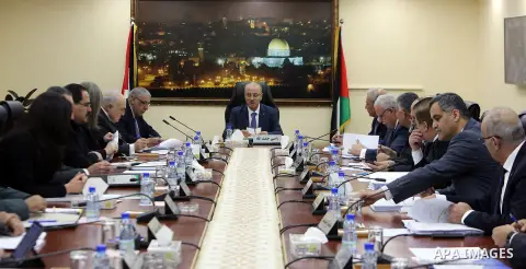 Palestinian Prime Minister Rami Hamdallah chairs a meeting of council of Ministers in the West Bank city of Ramallah on December 19, 2017. Photo by Prime Minister Office