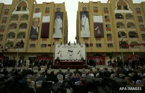 Qatar's Ambassador to the Palestinian Authority, Mohammed Al Emadi and Hamas Chief Ismail Haniyeh attend Qatar's National Day celebrations, in Khan Younis in the southern of Gaza strip, on December 19, 2017. Photo by Ram...