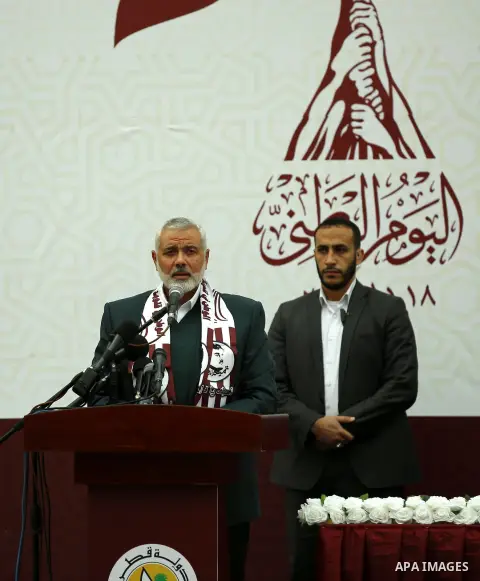 Qatar's Ambassador to the Palestinian Authority, Mohammed Al Emadi and Hamas Chief Ismail Haniyeh attend Qatar's National Day celebrations, in Khan Younis in the southern of Gaza strip, on December 19, 2017. Photo by Ram...