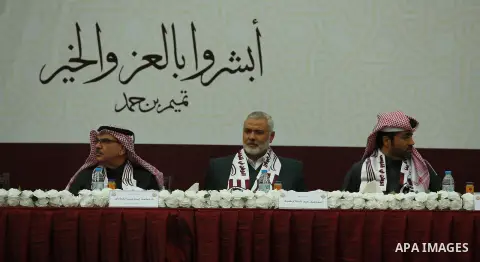 Qatar's Ambassador to the Palestinian Authority, Mohammed Al Emadi and Hamas Chief Ismail Haniyeh attend Qatar's National Day celebrations, in Khan Younis in the southern of Gaza strip, on December 19, 2017. Photo by Ram...