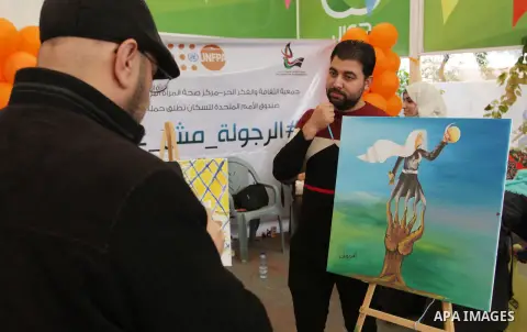 Palestinians attend a drawing competition during an initiative aimed at raising awareness on violence against women at Press House - Palestine (BAS) in Gaza city on December 20, 2017. Photo by Mahmoud Ajour
