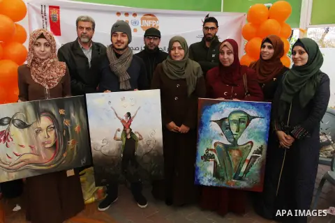 Palestinians attend a drawing competition during an initiative aimed at raising awareness on violence against women at Press House - Palestine (BAS) in Gaza city on December 20, 2017. Photo by Mahmoud Ajour