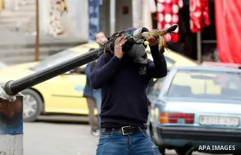 Palestinian protesters clash with Israeli security forces following a protest against U.S. President Donald Trump's decision to recognise Jerusalem as the capital of Israel, in the West Bank city of Hebron on December 20...