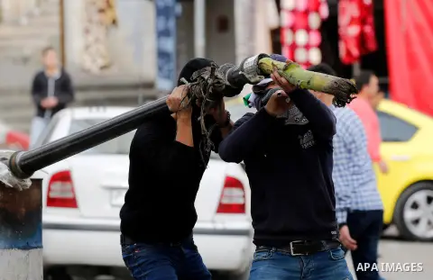 Palestinian protesters clash with Israeli security forces following a protest against U.S. President Donald Trump's decision to recognise Jerusalem as the capital of Israel, in the West Bank city of Hebron on December 20...