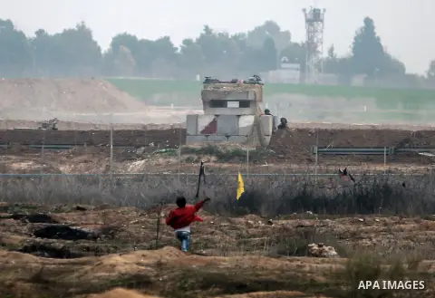 Palestinian protesters clash with Israeli security forces near the Israel-Gaza border east of Gaza City on December 20, 2017, as demonstrations continue over the US president's controversial recognition of Jerusalem as I...