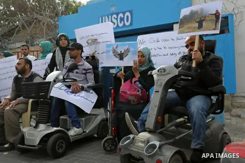 Disabled Palestinians take part in a protest against the killing of Ibraheem Abu Thuraya in front of the headquarter United Nation "UNESCO", in Gaza City, on December 21, 2017. Abu Thuraya, who was shot dead by Israeli s...
