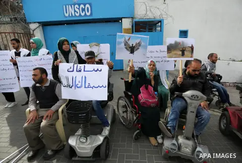 Disabled Palestinians take part in a protest against the killing of Ibraheem Abu Thuraya in front of the headquarter United Nation "UNESCO", in Gaza City, on December 21, 2017. Abu Thuraya, who was shot dead by Israeli s...