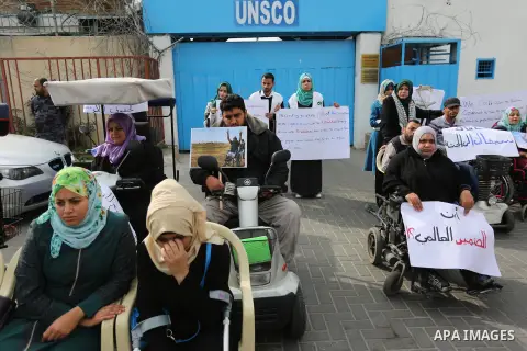 Disabled Palestinians take part in a protest against the killing of Ibraheem Abu Thuraya in front of the headquarter United Nation "UNESCO", in Gaza City, on December 21, 2017. Abu Thuraya, who was shot dead by Israeli s...