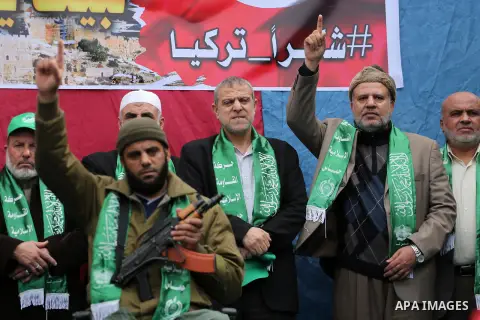 Palestinian supporters Hamas movement take part during a protest against U.S. President Donald Trump's decision to recognise Jerusalem as the capital of Israel, in Jabalia refugee camp in the northern Gaza strip on Decem...