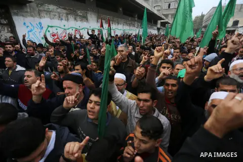 Palestinian supporters Hamas movement take part during a protest against U.S. President Donald Trump's decision to recognise Jerusalem as the capital of Israel, in Jabalia refugee camp in the northern Gaza strip on Decem...